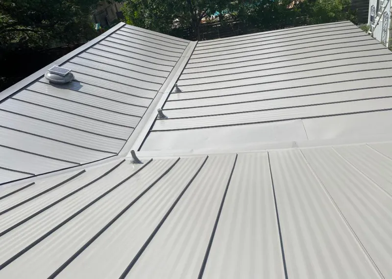 Solar attic fan installed on a metal roof for Roof Ventilation in Cumru